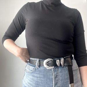 Black turtleneck by Philisophy